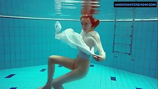 Redhead Diana hot and horny in a white dress